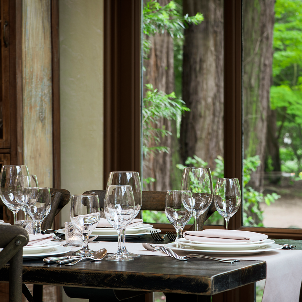 An elegant table is set in the SIMI Hospitality Center awaiting visiting guests